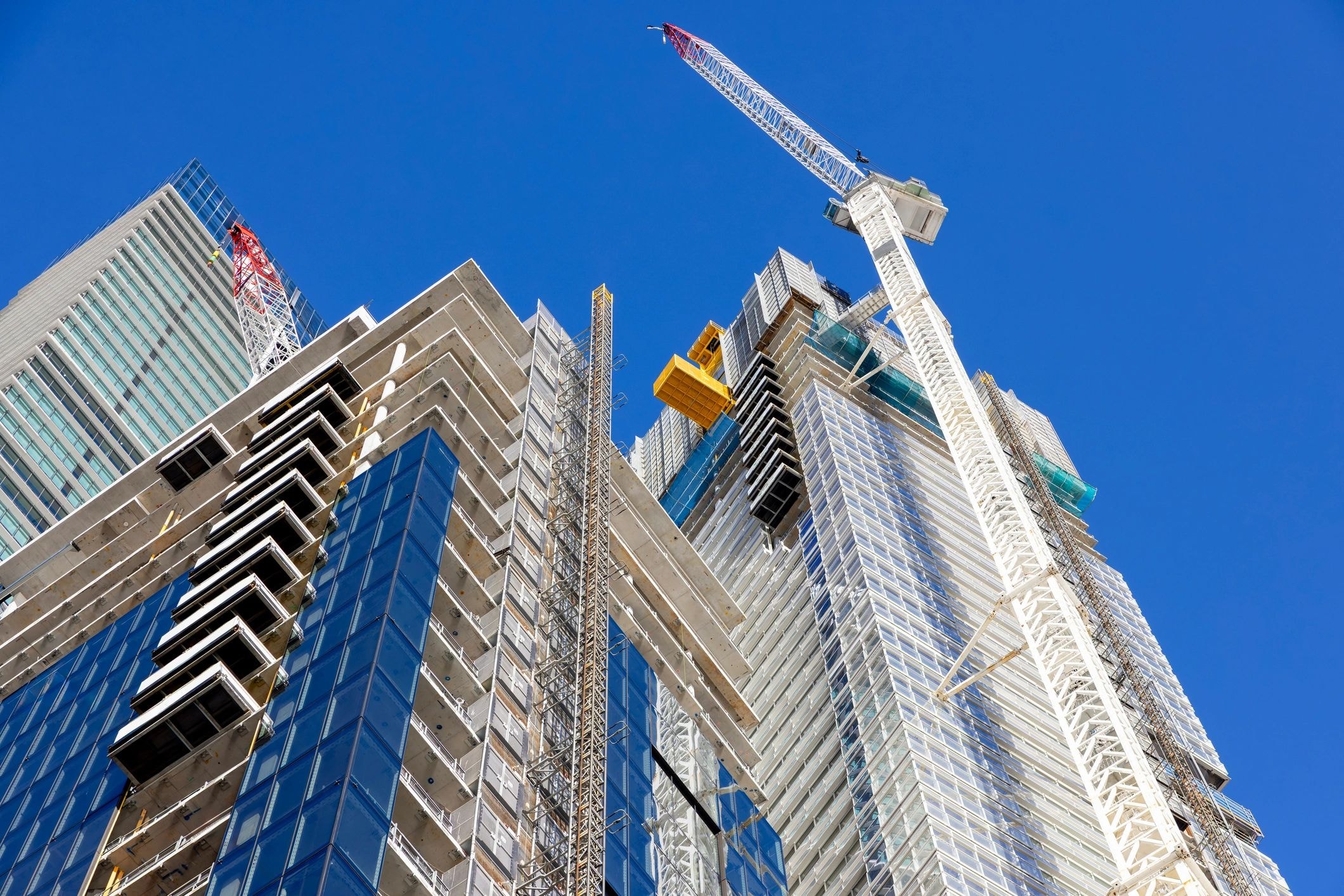 Construction crane towering over city buildings